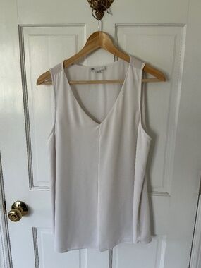 Lined sleeveless blouse with front inverted pleat detail